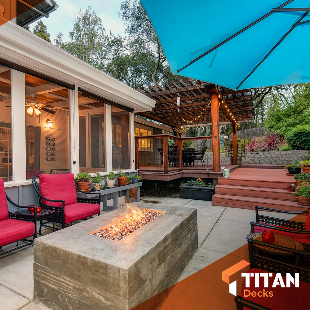 Photo of backyard with deck, pergola, and fire pit.