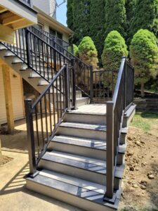 Composite deck with railing overlooking backyard Ann Arbor Fire Fox subdivision