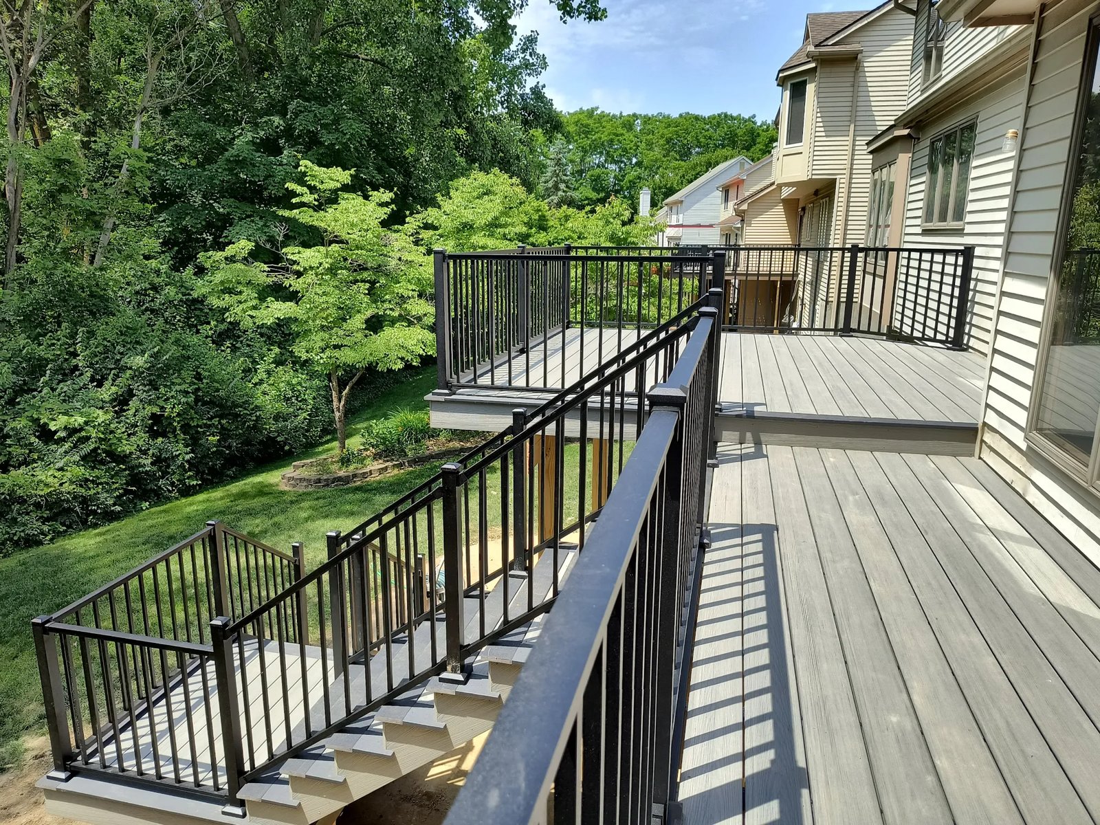 Full rear view of composite deck and stairs Ann Arbor Fire Fox subdivision