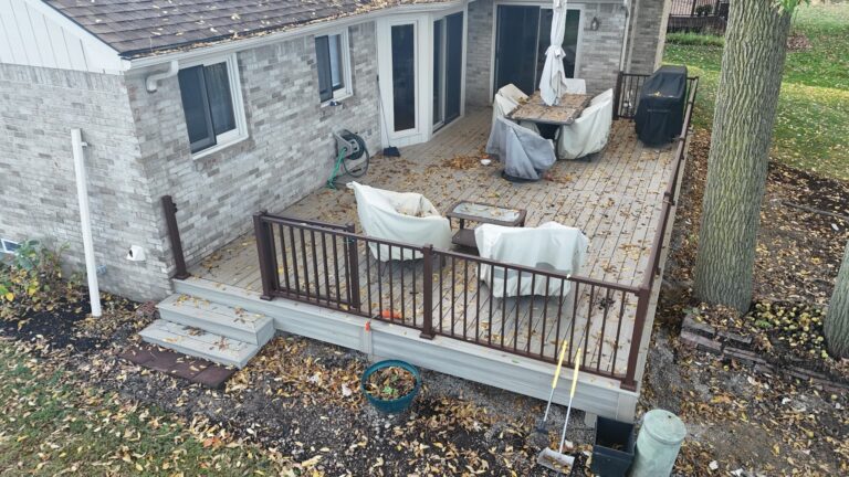 Composite deck built around mature trees Deerbrook Subdivision Novi Michigan