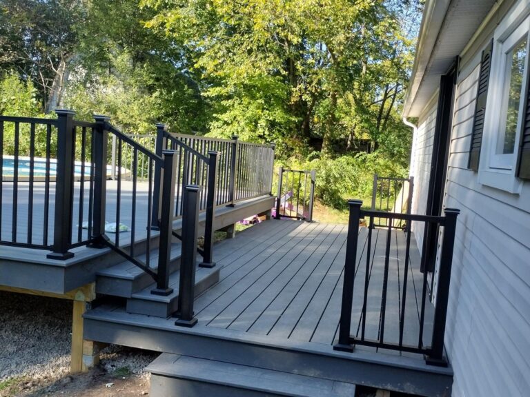 Side entry view of composite deck with railing in Salem Township MI