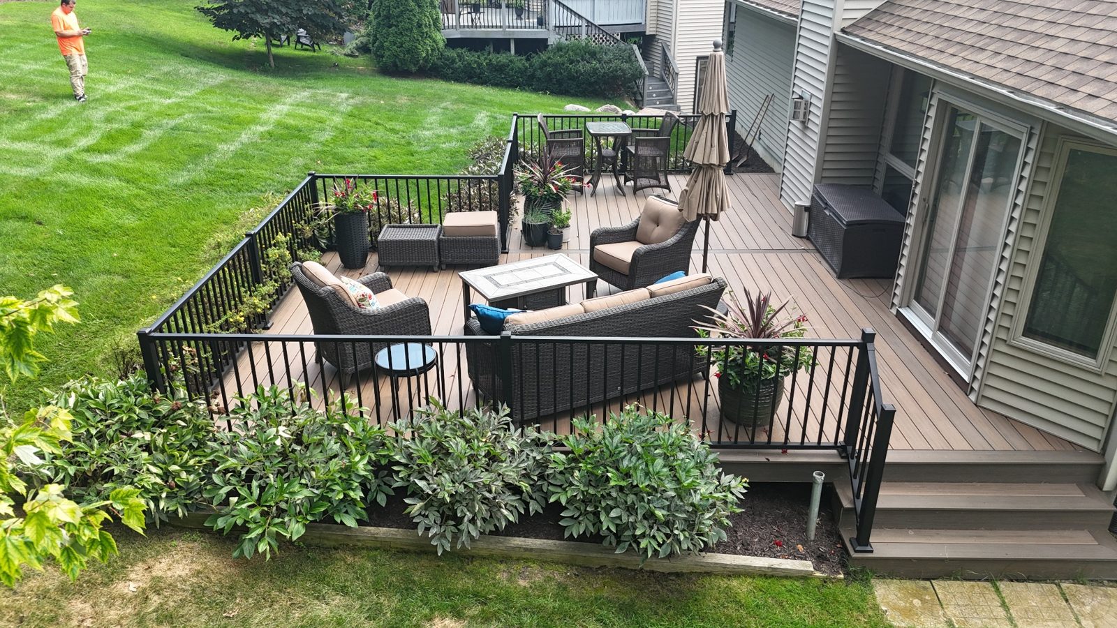 Backyard composite deck with seating area Brighton MI Trex Enhance Naturals