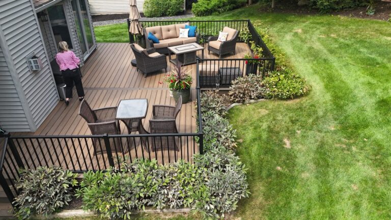 Trex deck with dual outdoor living zones Brighton MI backyard design