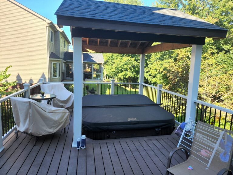 covered composite deck seating area with pergola structure in South Lyon MI