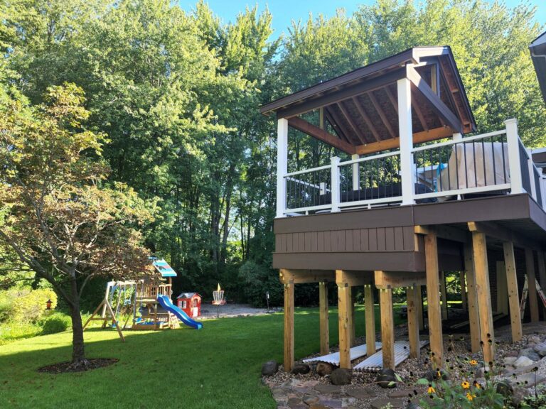 Elevated composite deck with support posts and pergola structure in South Lyon Michigan