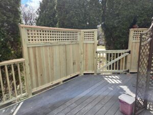 finished wood privacy wall with lattice top on deck