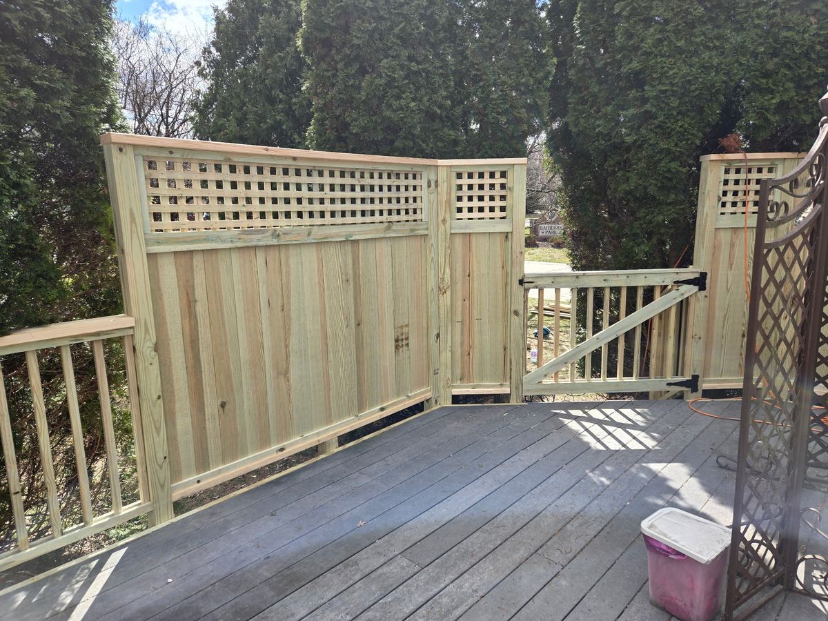 finished wood privacy wall with lattice top on deck