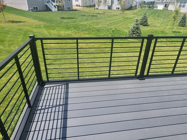 Trex Clamshell composite deck with black rod rail in Townes at Oak Pointe Green Oak Township MI