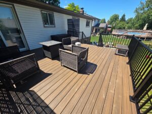 Trex composite deck rebuild with black aluminum railings in Canton Township Michigan