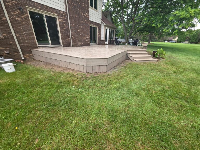 Composite deck stairs and resurfaced built-in bench in Milford, Michigan