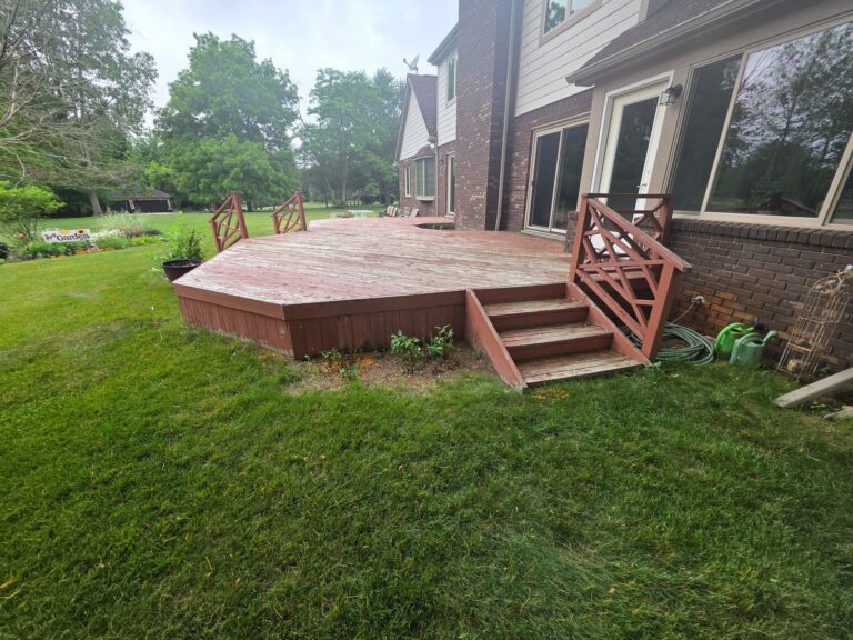 Original wood stairs and painted railings before deck renovation in Milford, Michigan