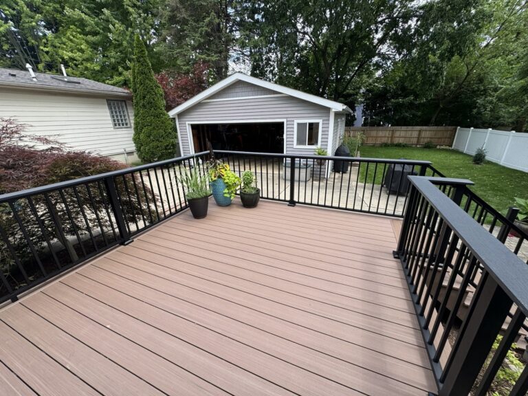 Backyard view of a Deckorators Summit Cliffside composite deck installed by Titan Decks in Historic Downtown Northville.