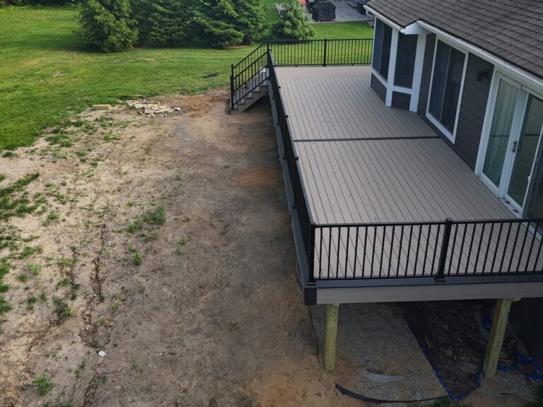 Deckorators Summit Cliffside deck with Dark Slate border and black Trex railings in Silver Pines Green Oak Township