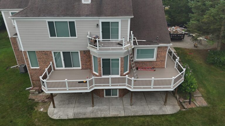 Centered aerial view of the Plymouth Township deck featuring Deckorators Summit Cliffside decking and Trex Select railing.